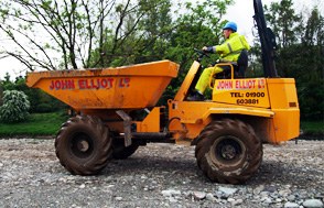 Swivel skip dumper in John Elliot Ltd livery