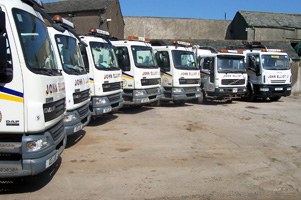 Row of John Elliot Ltd wagons in the yard