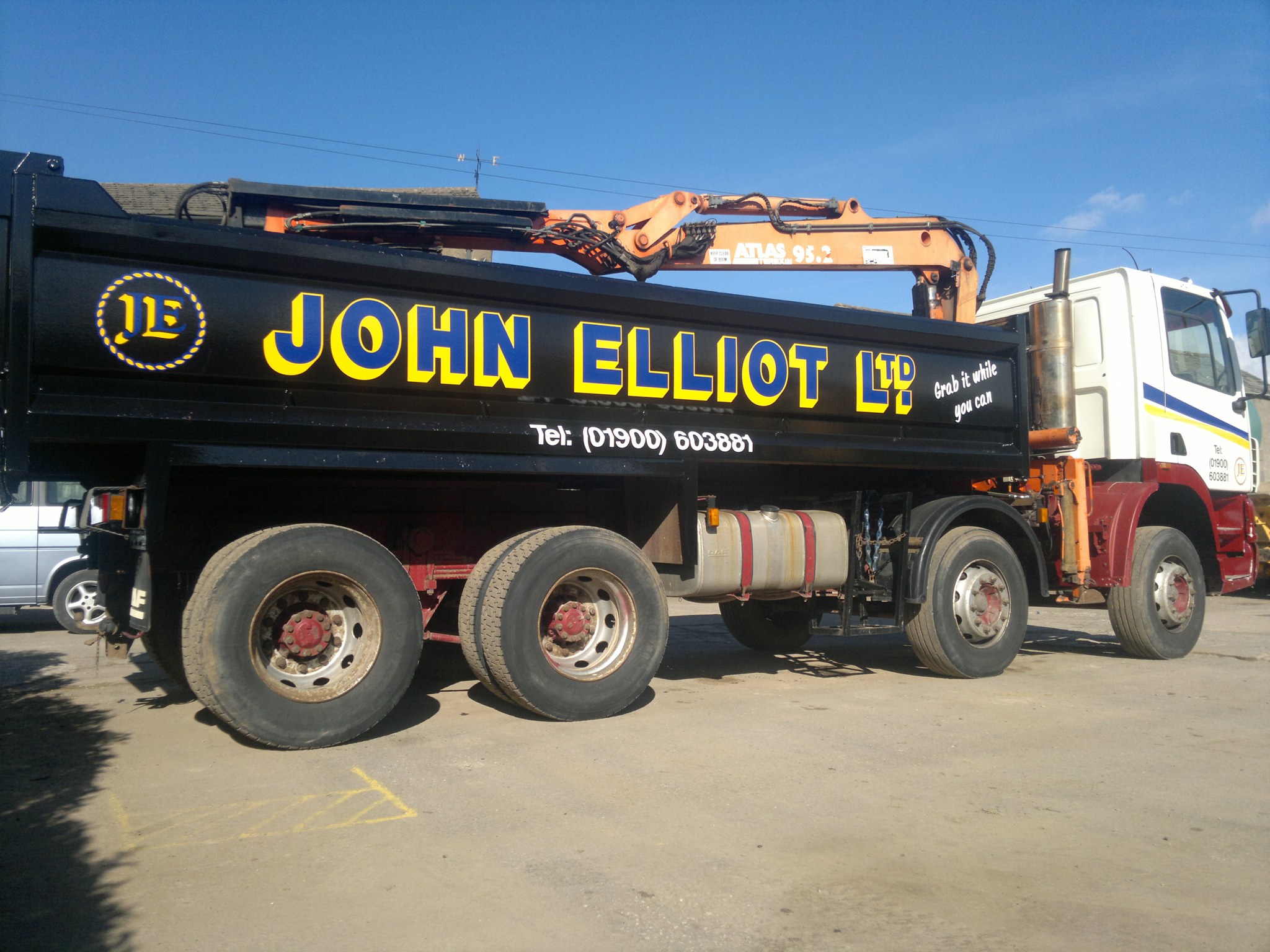Black John Elliot Ltd grab wagon with the JE roundel on the body
