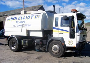 Older white Volvo road sweeper in John Elliot Ltd livery